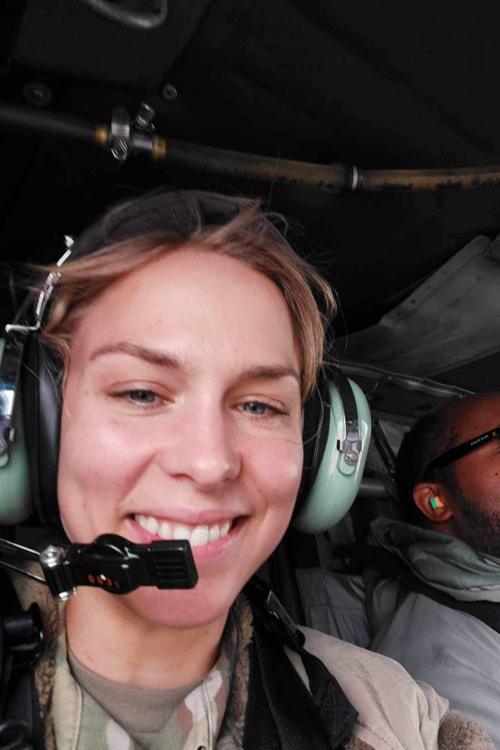 woman wearing pilot earphones and comms